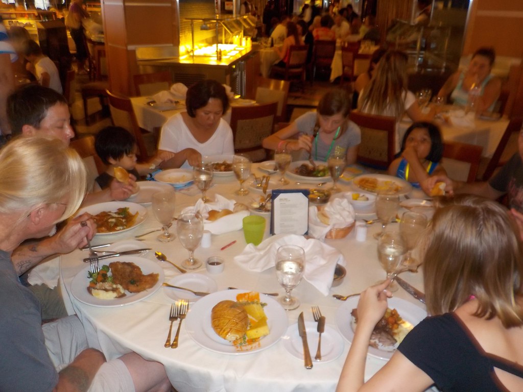 Restaurant dining scene with diners and plated meals